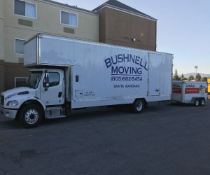 White Bushnell Moving box truck with branded trailer